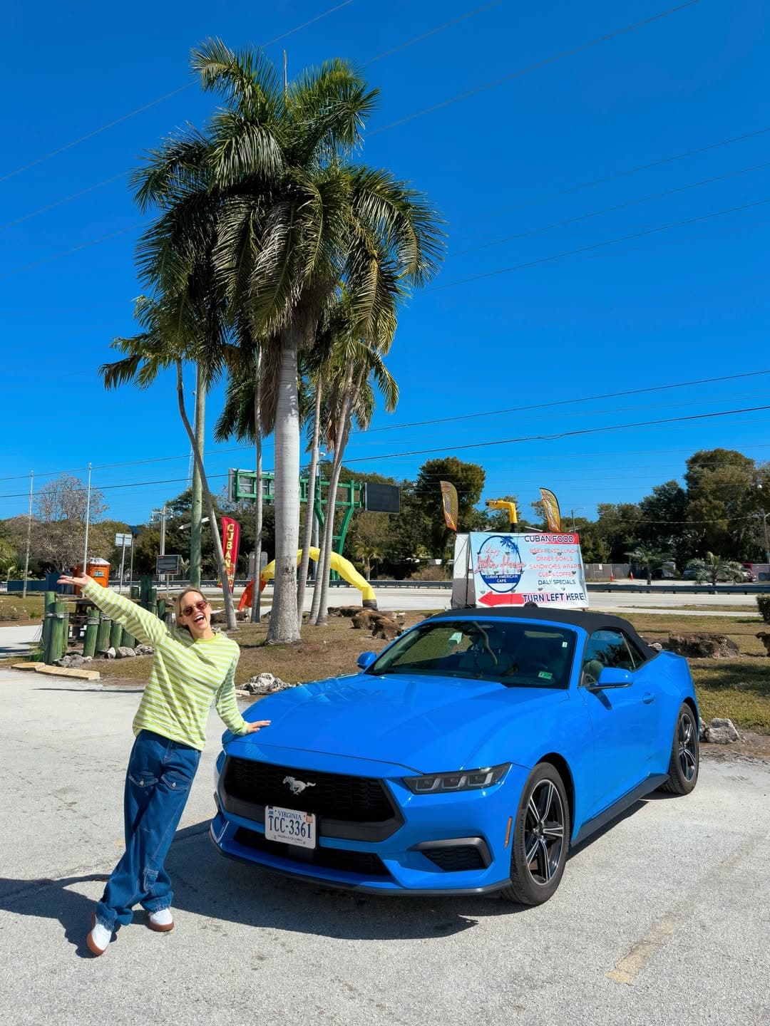 Adriana with a Mustang on a road trip